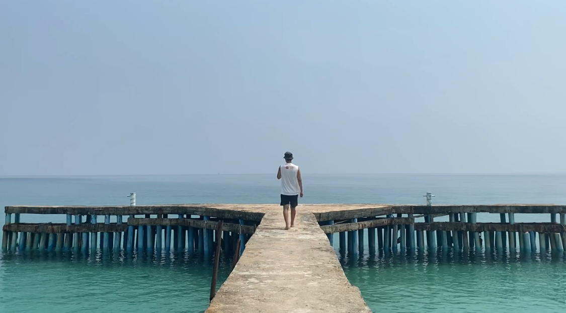 Walking along Coconut beach pier, Koh Rong