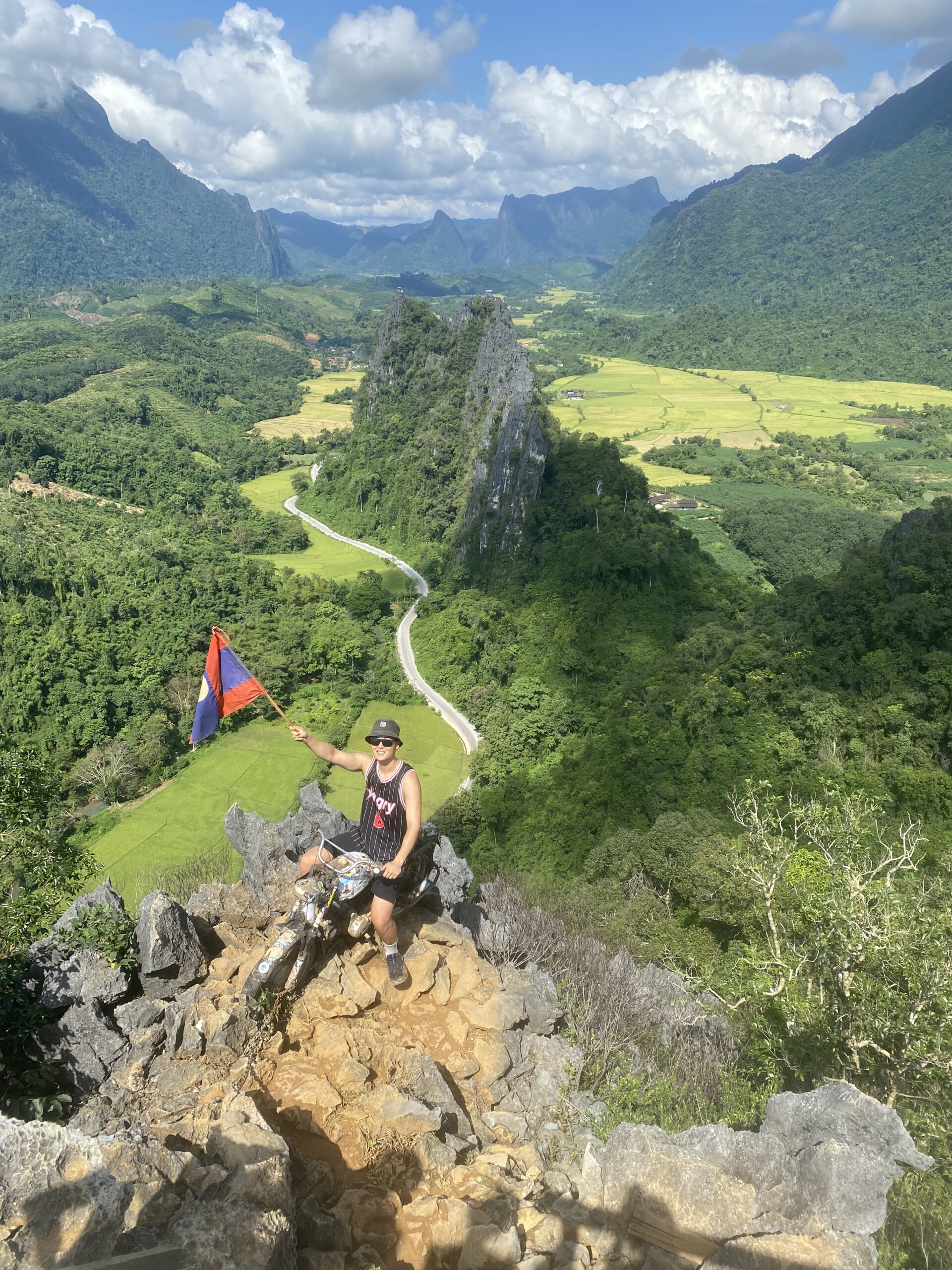 Sitting on top of the Motorbike Viewpoint in Vang Vieng, Laos